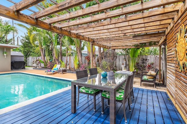 1707 NW 38th St, Oakland Park, FL 33309 - view of pool featuring a fenced backyard, a deck, a pergola, and outdoor dining space
