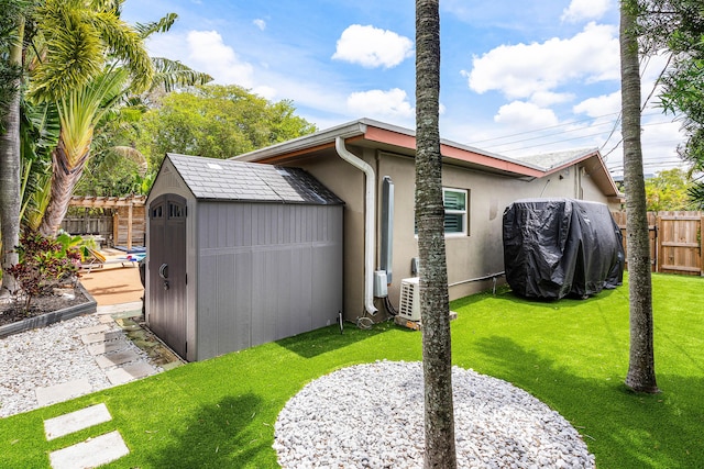 1707 NW 38th St, Oakland Park, FL 33309 - rear view of property with a storage shed, an outbuilding, stucco siding, and a cooling unit