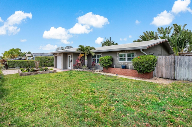 1707 NW 38th St, Oakland Park, FL 33309 - ranch-style home with an attached garage and stucco siding