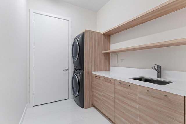 laundry room with stacked washing machine and dryer