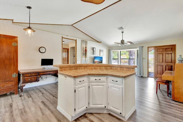 13298 82nd St N, West Palm Beach, FL 33412 - kitchen with open floor plan, a ceiling fan, light wood finished floors, lofted ceiling, and tile countertops