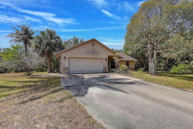 13298 82nd St N, West Palm Beach, FL 33412 - ranch-style house featuring driveway, stucco siding, stone siding, an attached garage, and a front lawn