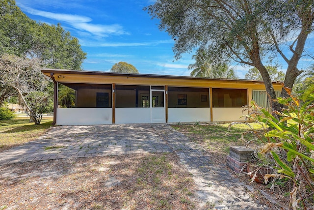 13298 82nd St N, West Palm Beach, FL 33412 - rear view of property with a sunroom