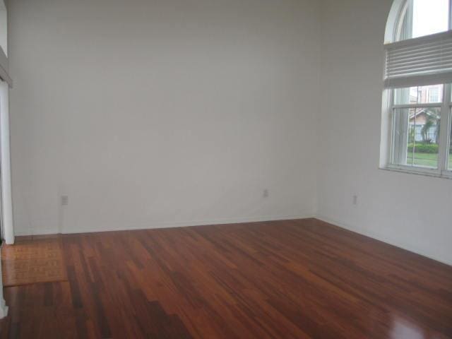 unfurnished room featuring wood finished floors