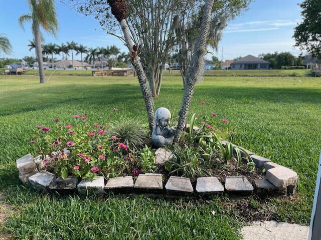 1618 SW Lexington Dr NW, Port Saint Lucie, FL 34953 - view of green lawn