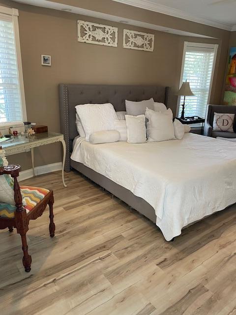 1618 SW Lexington Dr NW, Port Saint Lucie, FL 34953 - bedroom with ornamental molding and wood finished floors