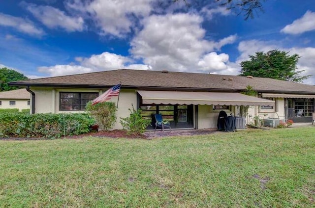 4728 Finchwood Rd Unit B, Boynton Beach, FL 33436 - back of house with a yard and stucco siding