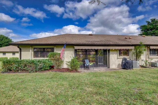 4728 Finchwood Rd Unit B, Boynton Beach, FL 33436 - rear view of property featuring a lawn, stucco siding, and cooling unit