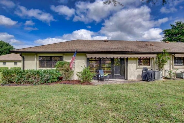 4728 Finchwood Rd Unit B, Boynton Beach, FL 33436 - back of house with a yard, stucco siding, and central AC unit