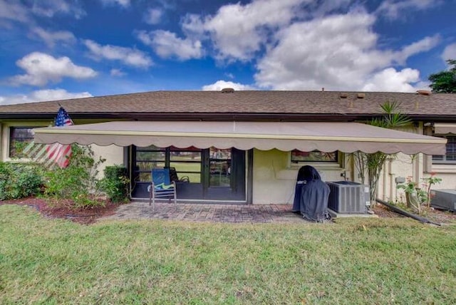 4728 Finchwood Rd Unit B, Boynton Beach, FL 33436 - back of property with cooling unit, a yard, and stucco siding
