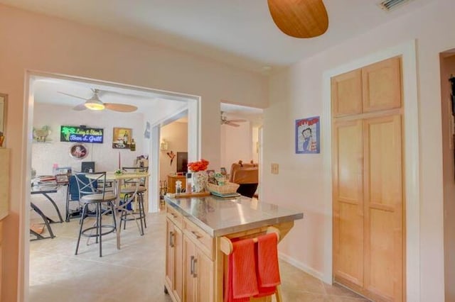 4728 Finchwood Rd Unit B, Boynton Beach, FL 33436 - kitchen featuring ceiling fan, light brown cabinetry, and light countertops