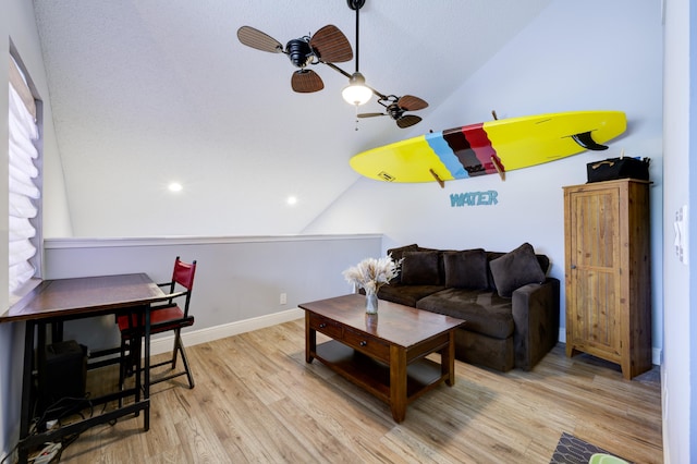 living area with lofted ceiling, a ceiling fan, wood finished floors, baseboards, and recessed lighting