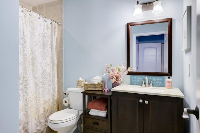 full bath featuring toilet, a shower with shower curtain, and vanity