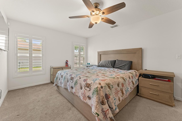 5248 NW Gamma St, Port Saint Lucie, FL 34986 - bedroom featuring light carpet, baseboards, and ceiling fan