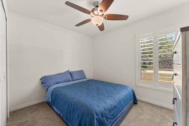 5248 NW Gamma St, Port Saint Lucie, FL 34986 - carpeted bedroom with baseboards and ceiling fan