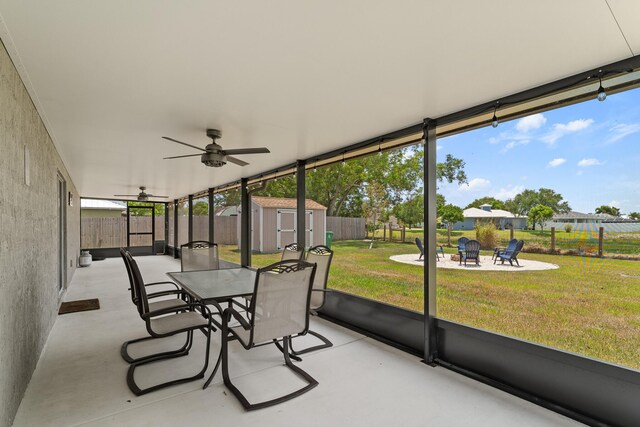 5248 NW Gamma St, Port Saint Lucie, FL 34986 - sunroom with an outdoor fire pit, ceiling fan, and outdoor dining space
