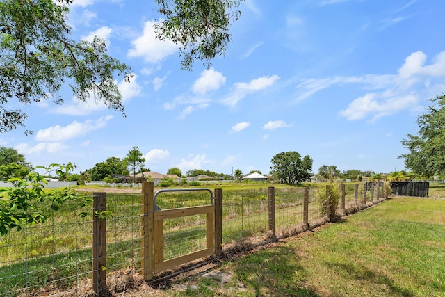 5248 NW Gamma St, Port Saint Lucie, FL 34986 - view of yard with a gate and a view of countryside