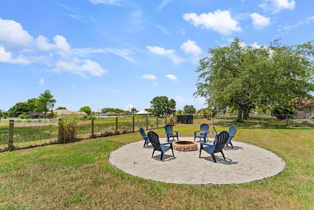 5248 NW Gamma St, Port Saint Lucie, FL 34986 - view of yard featuring an outdoor fire pit and a patio
