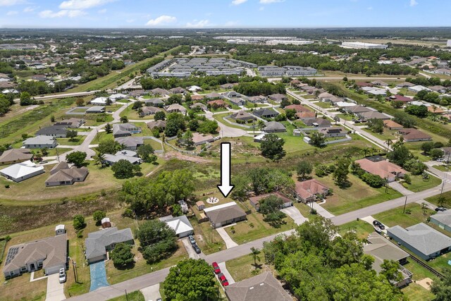 5248 NW Gamma St, Port Saint Lucie, FL 34986 - aerial view of property and surrounding area with nearby suburban area