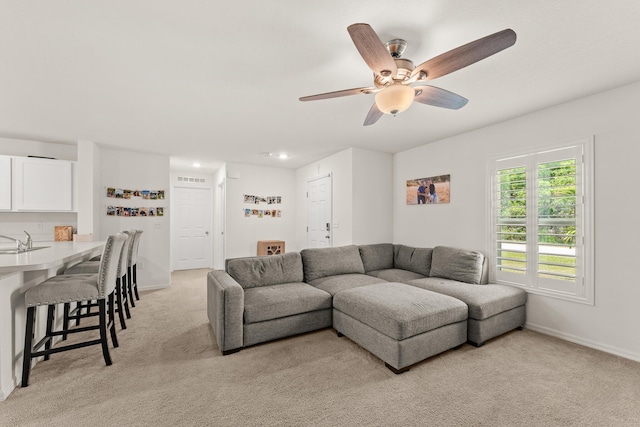 5248 NW Gamma St, Port Saint Lucie, FL 34986 - living area with light carpet, ceiling fan, and baseboards