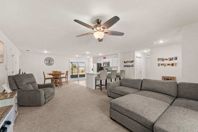 5248 NW Gamma St, Port Saint Lucie, FL 34986 - living room with ceiling fan, recessed lighting, and light carpet