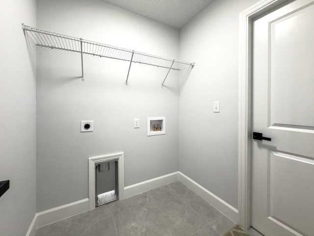 12180 SE 89th Ter, Belleview, FL 34420 - clothes washing area with hookup for an electric dryer, washer hookup, and baseboards
