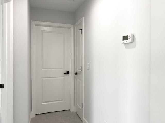 12180 SE 89th Ter, Belleview, FL 34420 - corridor with light tile patterned floors and baseboards