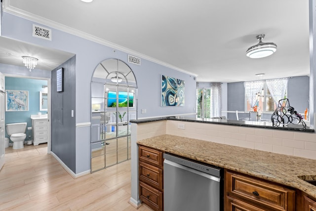 802 W Windward Way Unit 304, Lantana, FL 33462 - kitchen with dishwasher, crown molding, light stone counters, light wood-style flooring, and brown cabinetry