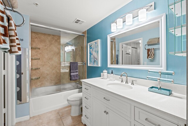 802 W Windward Way Unit 304, Lantana, FL 33462 - bathroom with toilet, combined bath / shower with glass door, vanity, and tile patterned floors