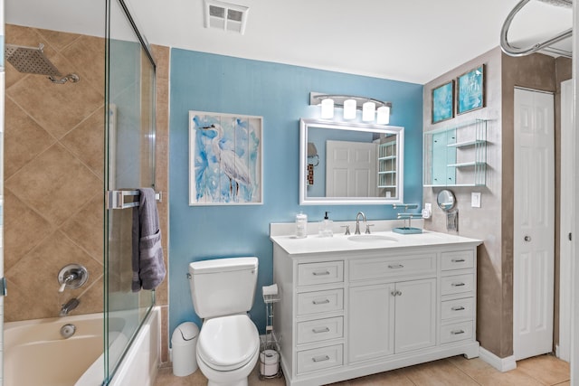 802 W Windward Way Unit 304, Lantana, FL 33462 - bathroom with toilet, combined bath / shower with glass door, vanity, and tile patterned floors
