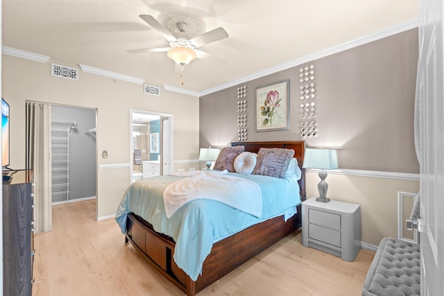 802 W Windward Way Unit 304, Lantana, FL 33462 - bedroom featuring radiator heating unit, wood finished floors, crown molding, a spacious closet, and a ceiling fan