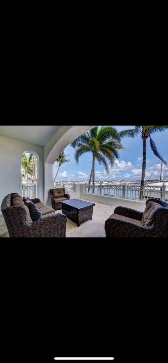 802 W Windward Way Unit 304, Lantana, FL 33462 - view of patio with outdoor lounge area and fence