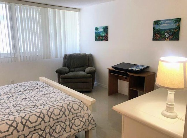 bedroom featuring multiple windows