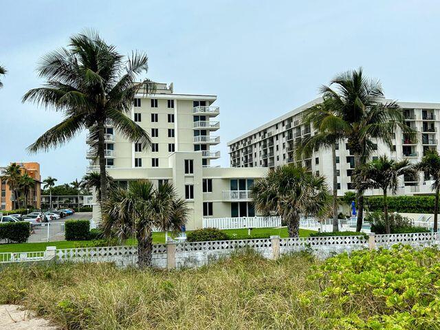 view of property with fence