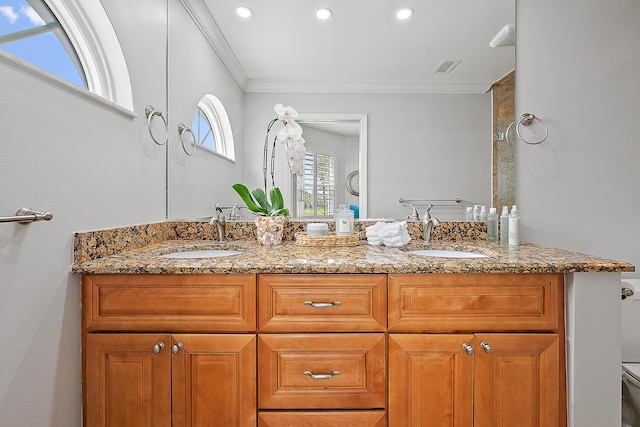 2703 Fairway Dr N, Jupiter, FL 33477 - bathroom featuring double vanity, crown molding, and recessed lighting