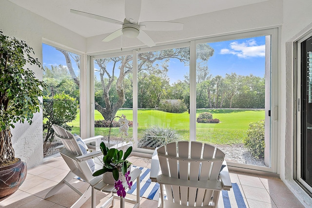 2703 Fairway Dr N, Jupiter, FL 33477 - sunroom / solarium with a ceiling fan, tile patterned floors, golf course view, and view of scattered trees