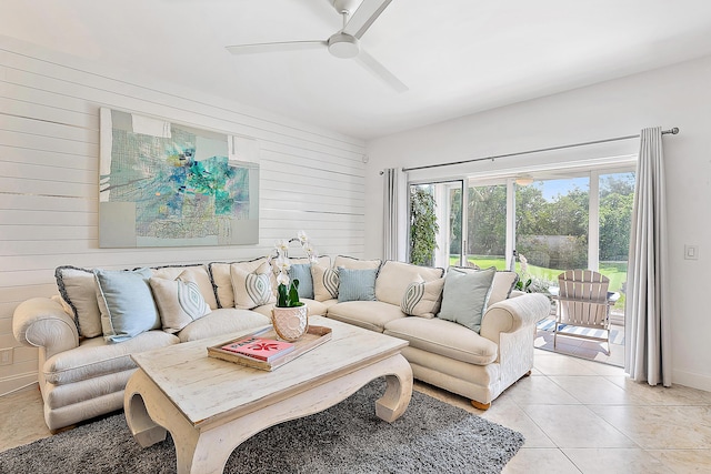 2703 Fairway Dr N, Jupiter, FL 33477 - living area featuring wooden walls, a ceiling fan, and light tile patterned flooring