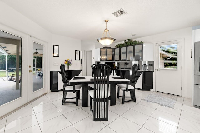 dining space with light tile patterned floors