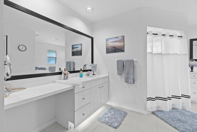 bathroom featuring vanity, curtained shower, and tile patterned flooring