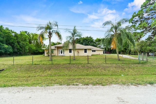 ranch-style home with fence