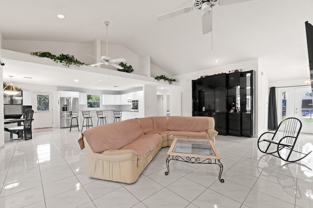 living area featuring a ceiling fan, high vaulted ceiling, recessed lighting, and light tile patterned flooring