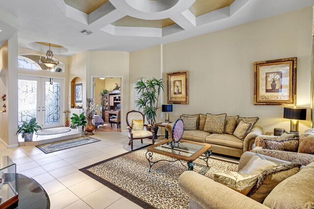 1815 Waldorf Dr, Royal Palm Beach, FL 33411 - tiled living area with coffered ceiling, a high ceiling, arched walkways, baseboards, and beam ceiling