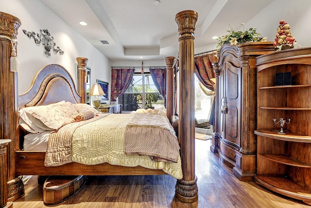 1815 Waldorf Dr, Royal Palm Beach, FL 33411 - bedroom with a raised ceiling, access to exterior, ornate columns, wood finished floors, and recessed lighting