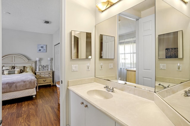 1815 Waldorf Dr, Royal Palm Beach, FL 33411 - ensuite bathroom featuring wood finished floors and vanity