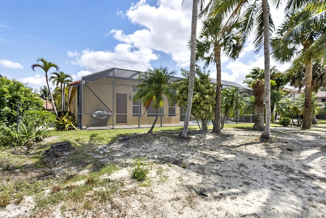 1815 Waldorf Dr, Royal Palm Beach, FL 33411 - back of property featuring glass enclosure and stucco siding