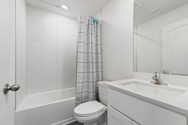 bathroom featuring toilet, shower / bath combo with shower curtain, and vanity