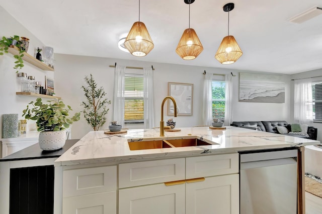 115 W 31st Ct, Riviera Beach, FL 33404 - kitchen featuring plenty of natural light, open floor plan, visible vents, and dishwasher