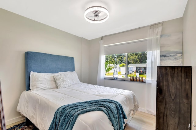 115 W 31st Ct, Riviera Beach, FL 33404 - bedroom with wood finished floors and baseboards