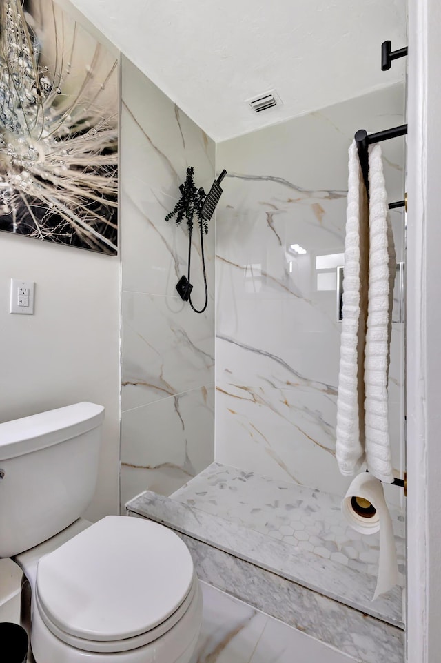 115 W 31st Ct, Riviera Beach, FL 33404 - bathroom with toilet, a marble finish shower, marble finish floor, and visible vents