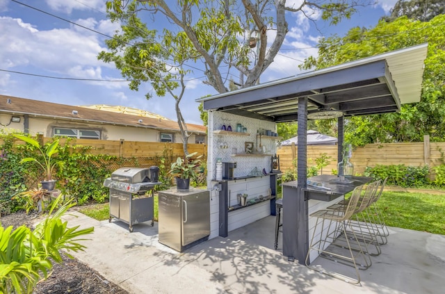 115 W 31st Ct, Riviera Beach, FL 33404 - view of patio / terrace with fence and a grill
